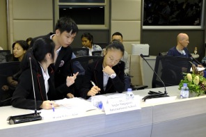 Student's discuss their final arguments at the debate